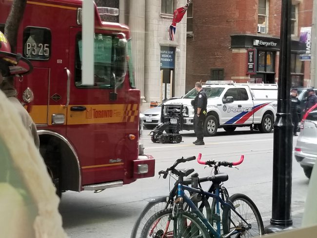 Man charged with mischief after suspicious package found outside Toronto police HQ - image