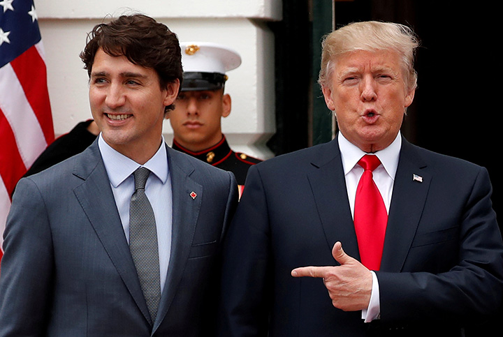 U.S. President Donald Trump welcomes Prime Minister Justin Trudeau on the South Lawn before their meeting about the NAFTA trade agreement at the White House in Washington. October 11, 2017.  
