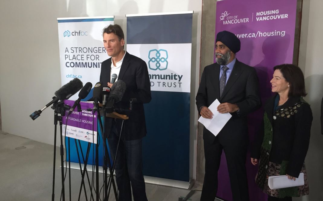 Vancouver Mayor Gregor Robertson alongside Minister Harjit Sajjan and Minister Selina Robinson announce opening of first land trust building.