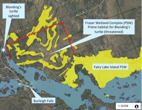 A map outlines wetlands and the red line indicates where the condo complex was proposed.