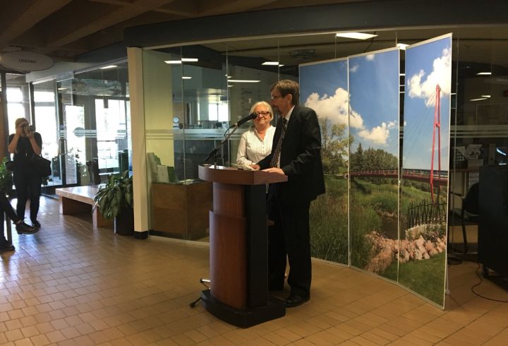 Bret McCann speaks at the unveiling of a sculpture in St. Albert that is meant to pay tribute to his parents, Lyle and Marie McCann.