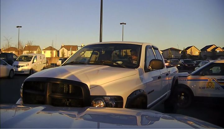 The RCMP released photos of a stolen pickup truck on Thursday night just hours after they said the driver rammed two of their police cruisers in a Walmart parking lot in Okotoks.