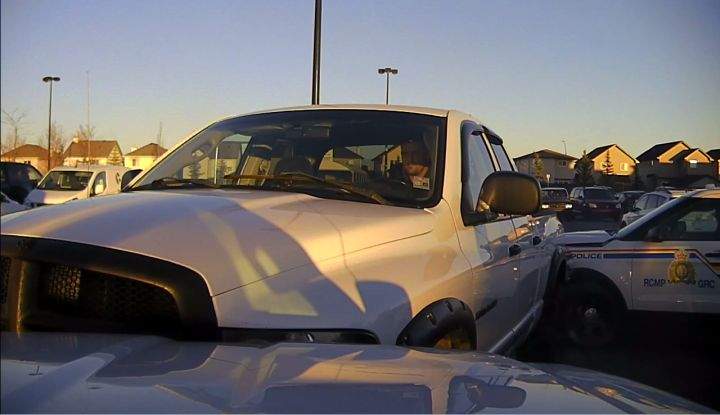 The RCMP released photos of a stolen pickup truck on Thursday night just hours after they said the driver rammed two of their police cruisers in a Walmart parking lot in Okotoks.