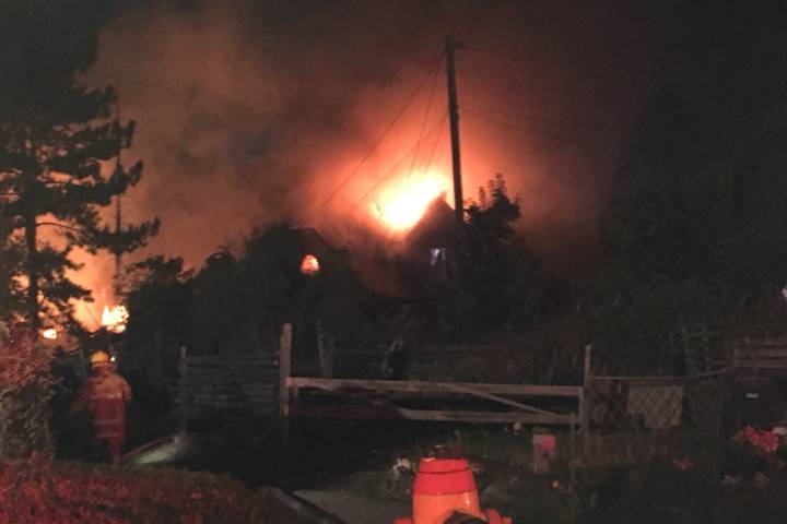 A major fire destroyed two homes in Penticton Wednesday night. One woman remains unaccounted for.