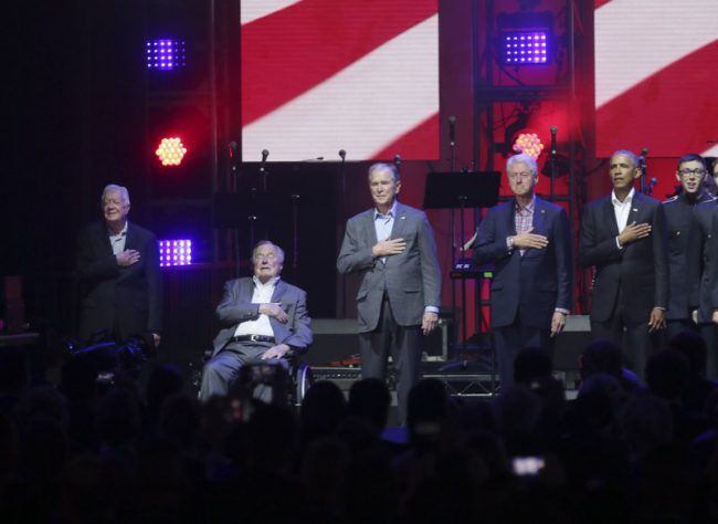 Former Presidents Barack Obama, Bill Clinton, George W. Bush, George H.W. Bush and Jimmy Carter gather on stage at the opening of a hurricanes relief concert in College Station, Texas, Saturday, Oct. 21, 2017.