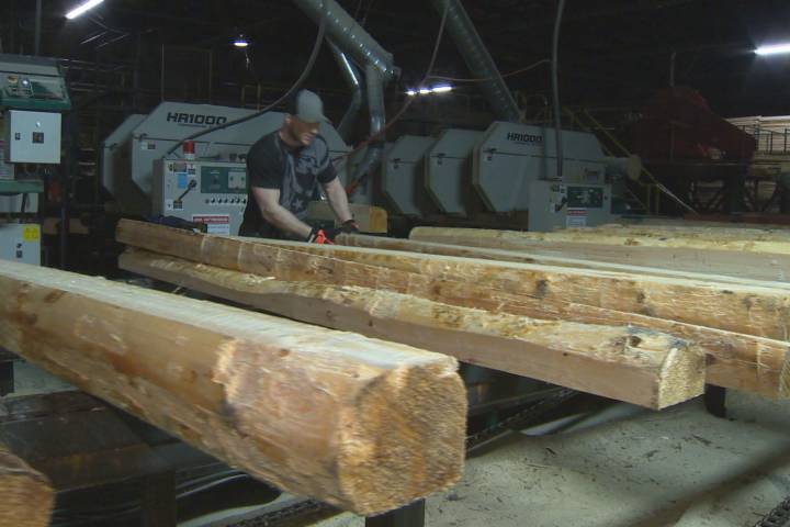 A worker at a softwood lumber mill in Fredericton.