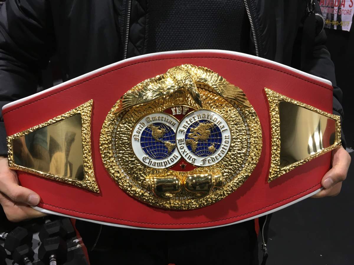 Calgary’s Steve “The Dragon” Claggett shows off the IBF North American super lightweight title belt he won on Friday, Oct. 27 in Montreal.