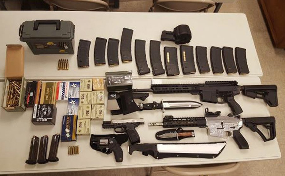 In this undated photo released by the Washington County Sheriff's office, a cache of weapons is displayed in Johnson City Tenn. 