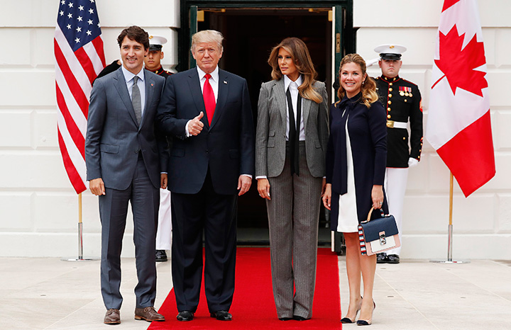 U.S. President Donald Trump gives a thumbs up as he and first lady Melania Trump welcome Prime Minister Justin Trudeau and Sophie Gregoire Trudeau at the White House in Washington, October 11 2017.