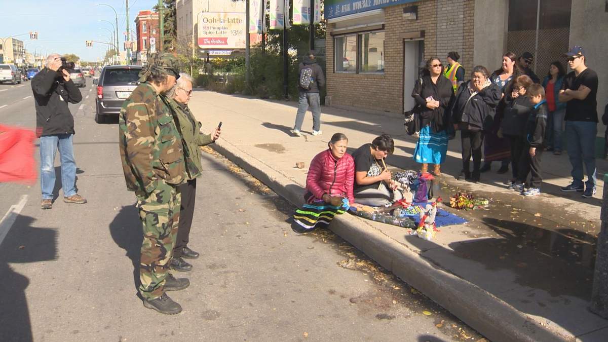 Family members hold a vigil in Winnipeg's Northend Oct. 11 to honour a loved-one killed by an impaired off-duty City cop. 