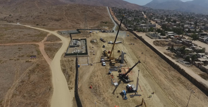 An aerial view of Mexico border wall prototypes being constructed.
