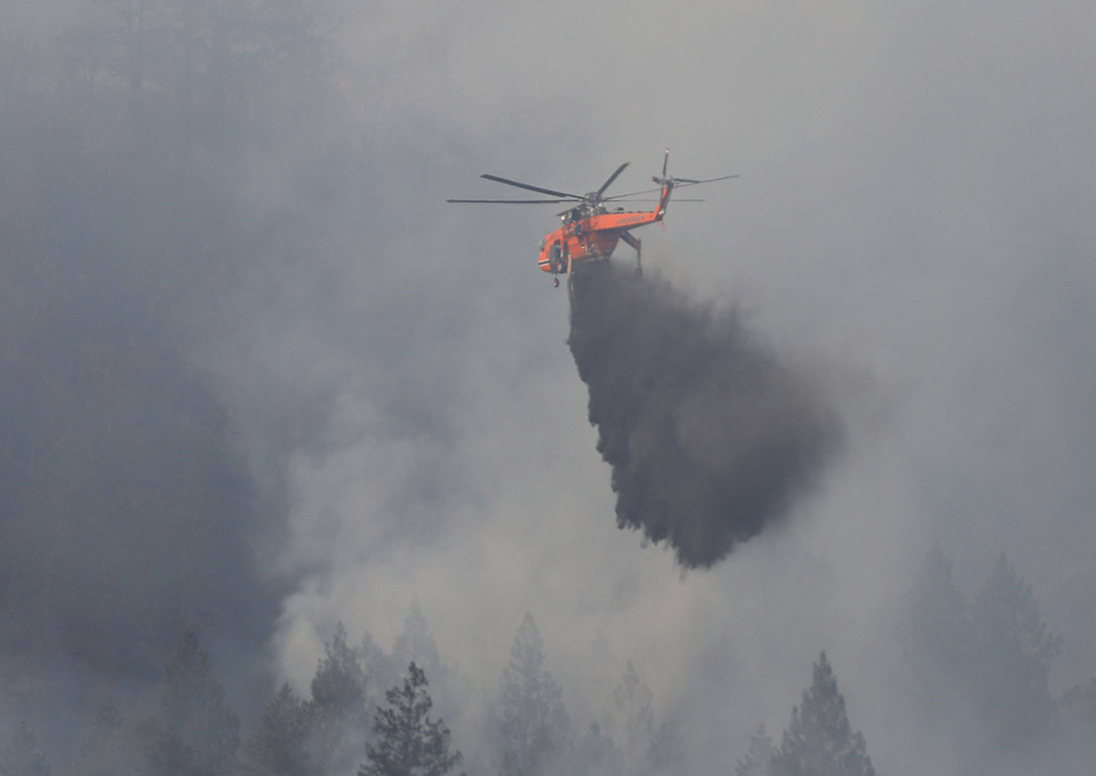 Firefighting helicopters work to contain a wildfire near Oakville, California, U.S., October 16, 2017. 