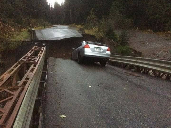 A car is caught on a broken Williams Creek bridge. Posted on Facebook Oct 25.