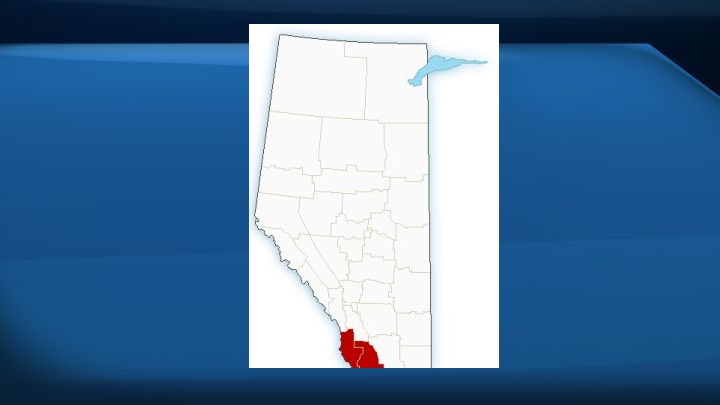 A map of Alberta with areas in red indicating where Environment Canada issued a wind warning.