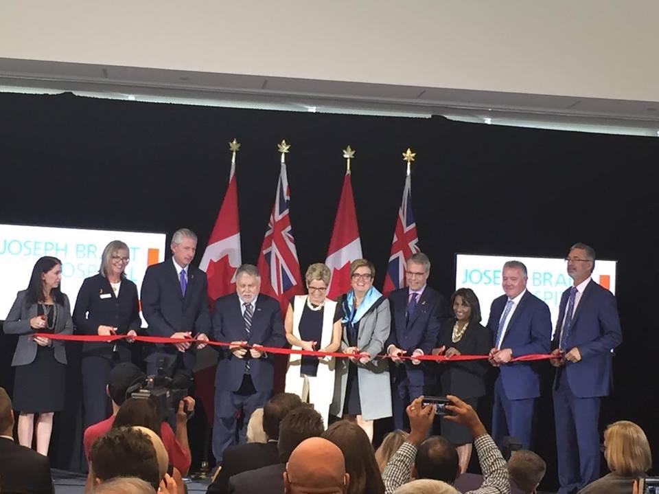 Premier Kathleen Wynne cuts ribbon at grand opening of the new Michael Lee-Chin and Family patient centre at Joseph Brant Hospital.