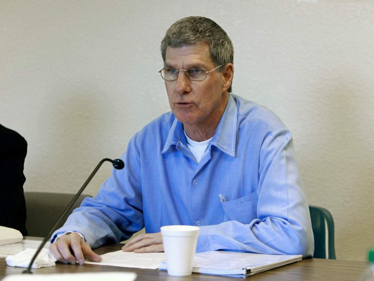 Former Charles Mansion follower, Charles ‘Tex” Watson, reads a prepared statement during his parole hearing at Mule Creek State Prison, Ione, Calif. Nov. 16, 2011.