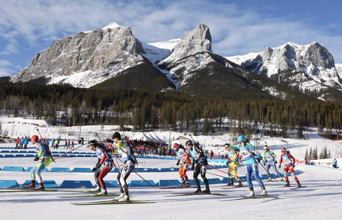 The women’s field leaves the start during the single mixed relay at the IBU biathlon World Cup in Canmore, Alta., Sunday, Feb. 7, 2016.