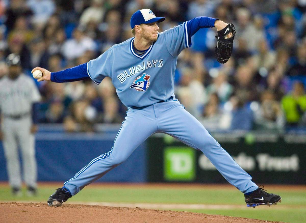 Toronto Blue Jays starting pitcher Roy Halladay throws against the Seattle Mariners during fourth inning AL baseball game action in Toronto September 25, 2009. Retired Blue Jays ace Halladay is among the 2017 Canadian Baseball Hall of Fame inductees. THE CANADIAN PRESS/Fred Thornhill