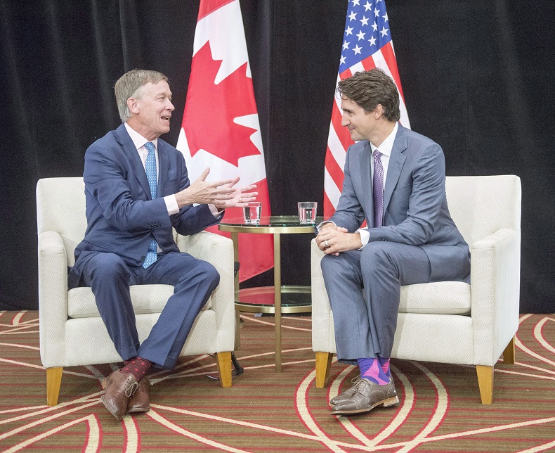 Justin Trudeau meets Colorado Governor John Hickenlooper in July in Providence, R.I.