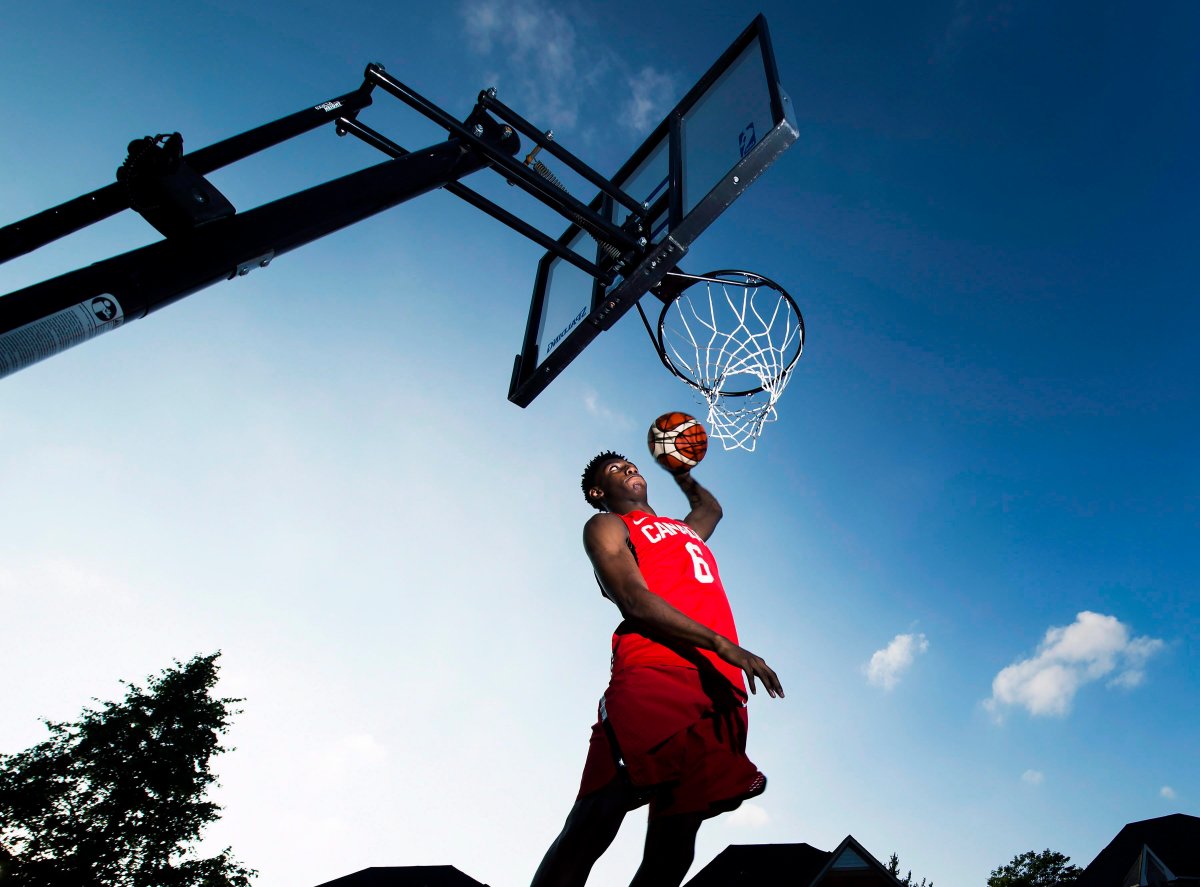 R.J. Barrett, 17, slam dunks the ball outside his home in Mississauga, Ont., on Thursday, July 20, 2017. Whether it was starring for Canada, or at the prestigious Nike Hoop Summit and the Basketball Without Borders game at the NBA's all-star weekend, Barrett has proven he can more than hold his own against players years older.