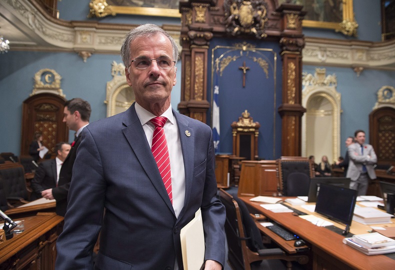 Independent MNA Guy Ouellette walks into the National Assembly on Tuesday.