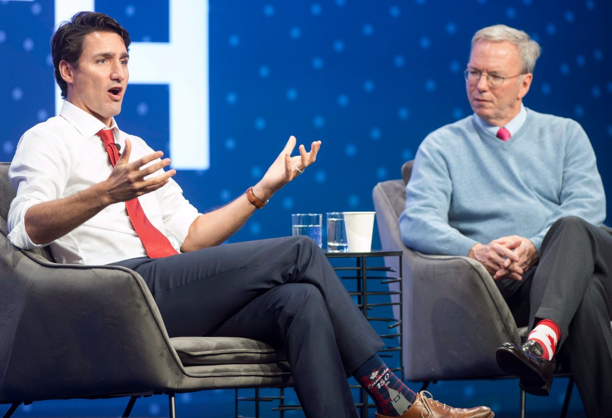 Prime Minister Justin Trudeau speaks with executive chairman of Alphabet Inc. Eric Schmidt at the Google Go North conference at the Evergreen Brickworks in Toronto on Thursday.