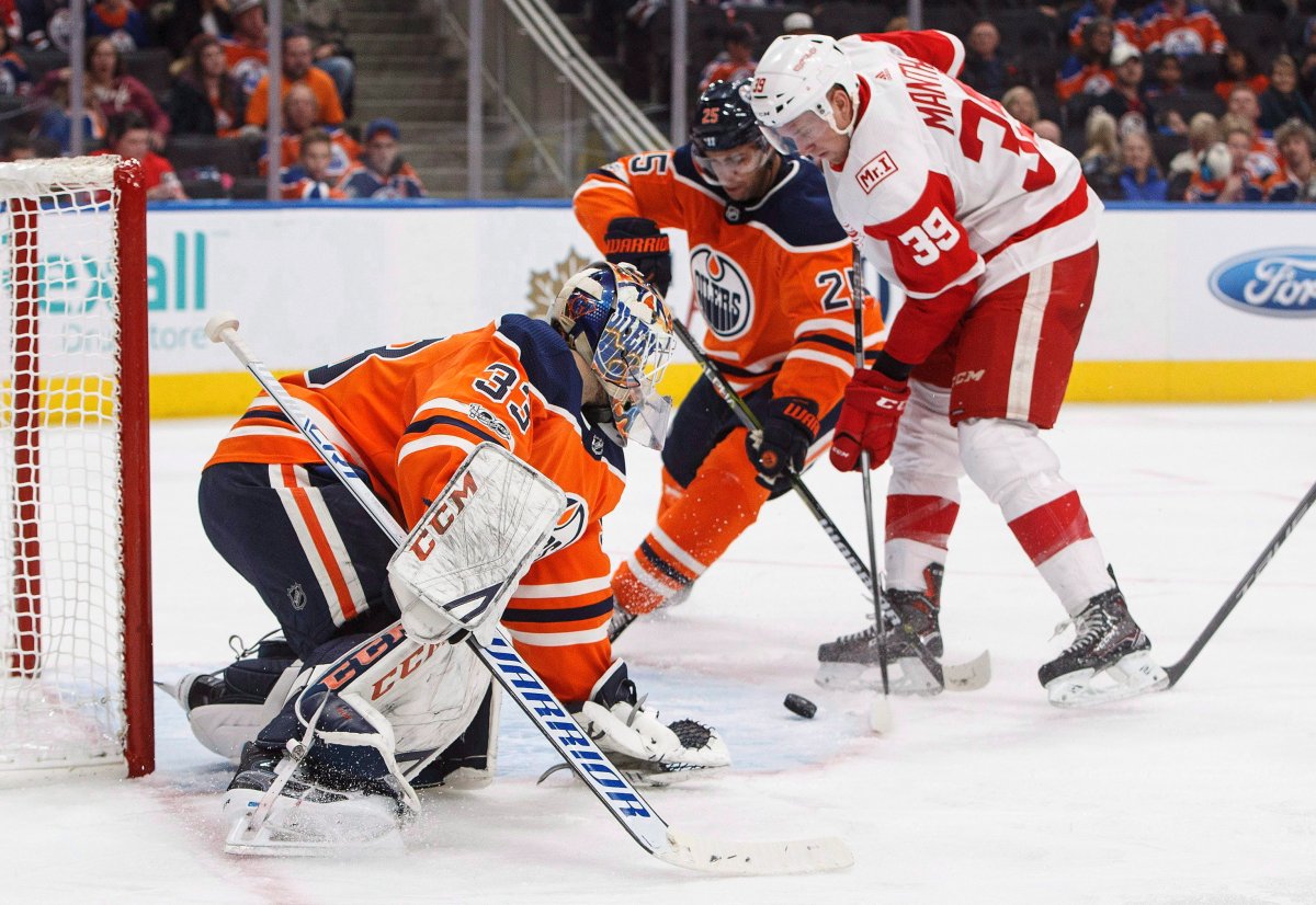Detroit Red Wings Anthony Mantha (39) scores a goal on Edmonton Oilers goalie Cam Talbot (33) as Darnell Nurse (25) defends during third period NHL action in Edmonton, Alta., on Sunday, November 5, 2017. 