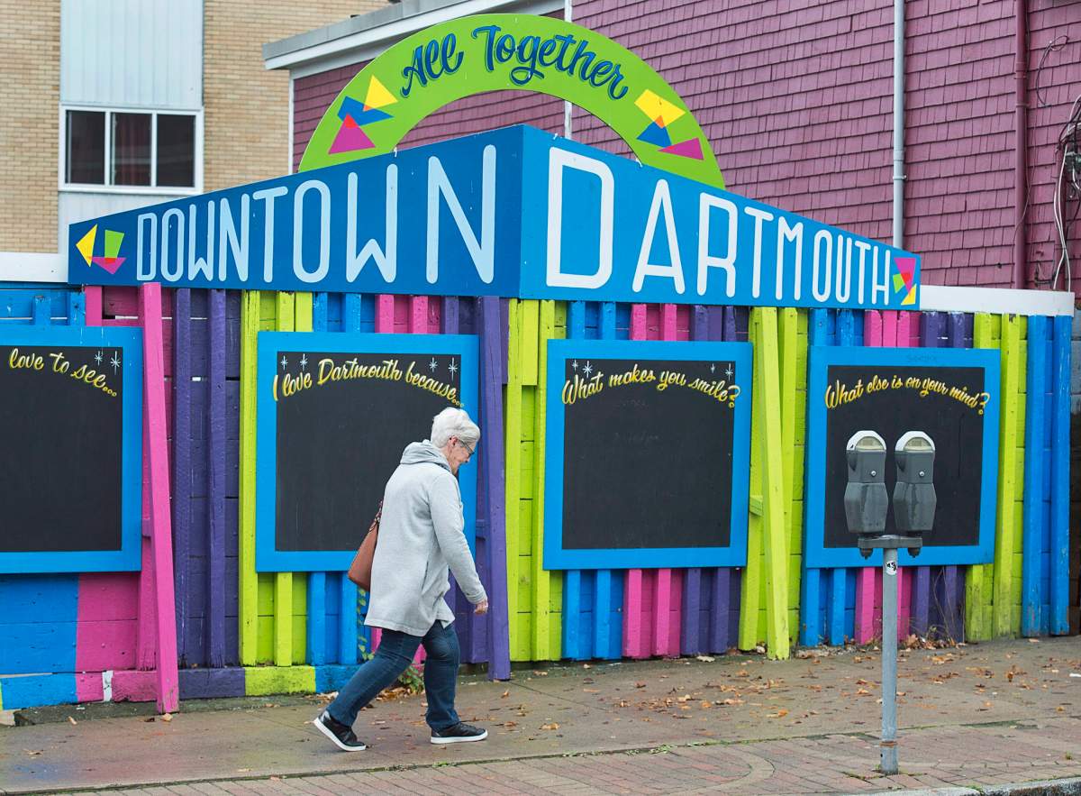 A pedestrian walks in downtown Dartmouth, N.S. on Monday, Nov. 6, 2017.