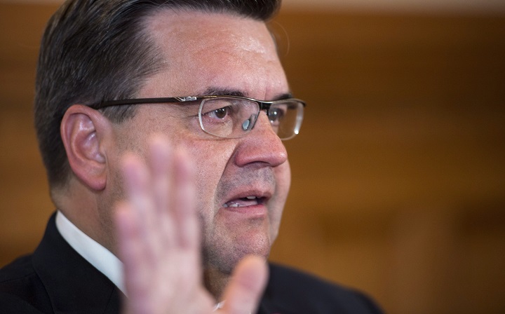Outgoing Montreal mayor Denis Coderre waves goodbye at the end of a news conference in Montreal on Wednesday, November 8, 2017.