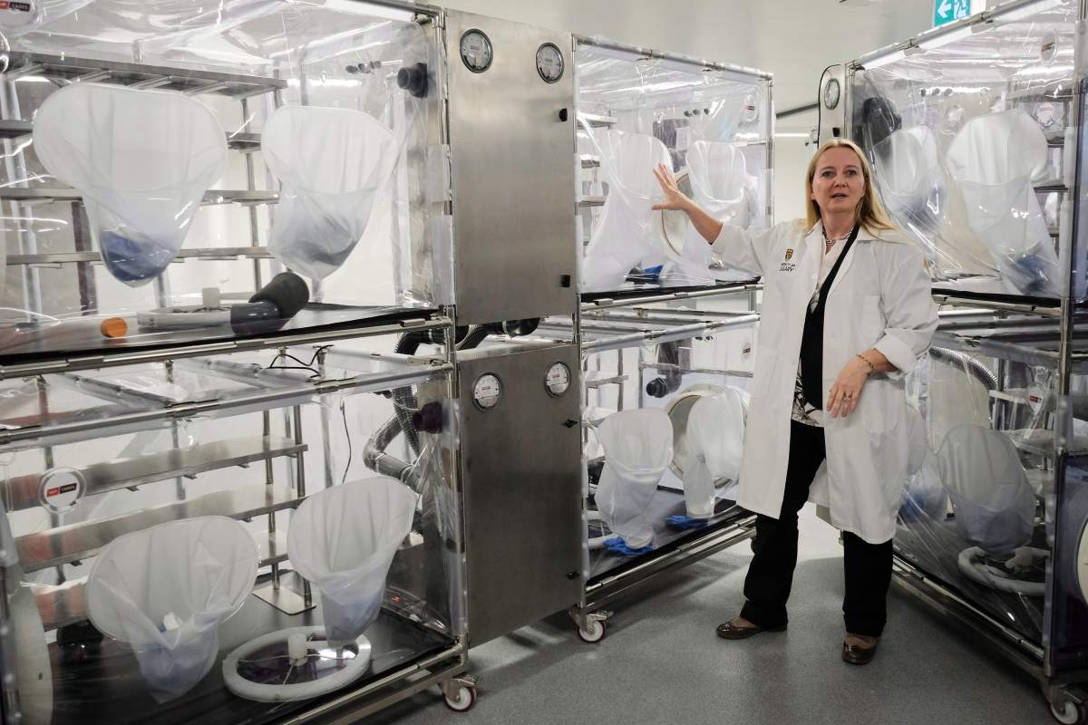 Dr. Kathy McCoy, director of the Western Canadian Microbiome Centre, explains the sterile enclosures where mice will live during a tour of the facility prior to it opening in Calgary, Alta., Thursday, Oct. 12, 2017.