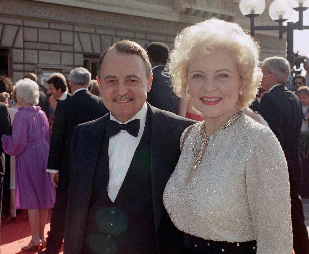  This Sept. 22, 1985, file photo shows John Hillerman, left, and Betty White, right, arriving at Emmy Awards in Pasadena, Calif. A spokeswoman for the family of Hillerman says the co-star of TV Magnum, P.I. has died. Hillerman was 84. Spokeswoman Lori De Waal said Hillerman died Thursday at his home in Houston.