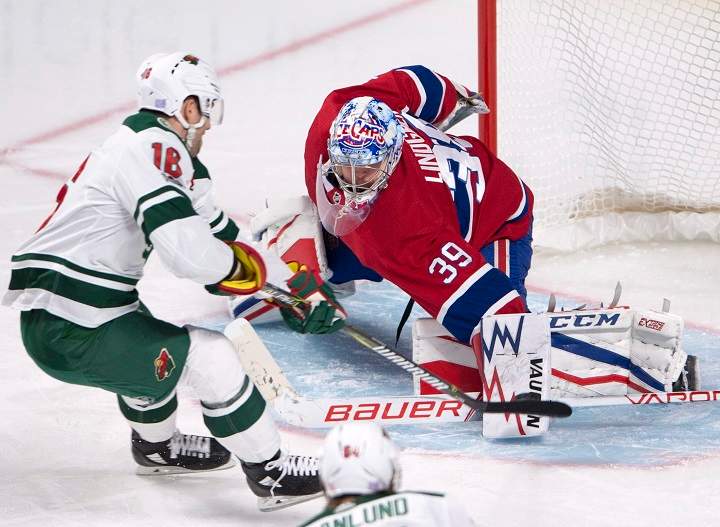 Minnesota Wild left wing Jason Zucker (16) celebrates after scoring the first goal on Montreal Canadiens goalie Charlie Lindgren (39) during third period NHL hockey action in Montreal on Thursday, November 9, 2017. THE CANADIAN PRESS/Ryan Remiorz