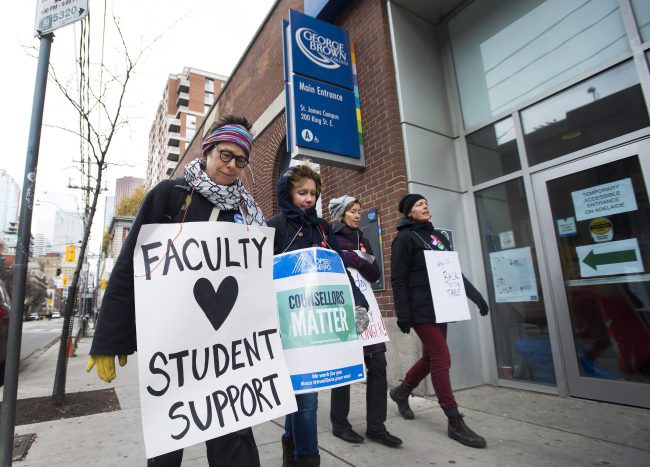 Teachers and faculty staff of the Ontario Public Service Employees Union walk the picket line at George Brown College in Toronto on Thursday, November 16, 2017.