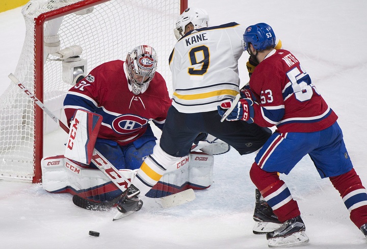 Montreal Canadiens goaltender Carey Price makes a save against Buffalo Sabres' Evander Kane (9) as Canadiens' Victor Mete defends during second period NHL hockey in Montreal, Saturday, November 25, 2017. 