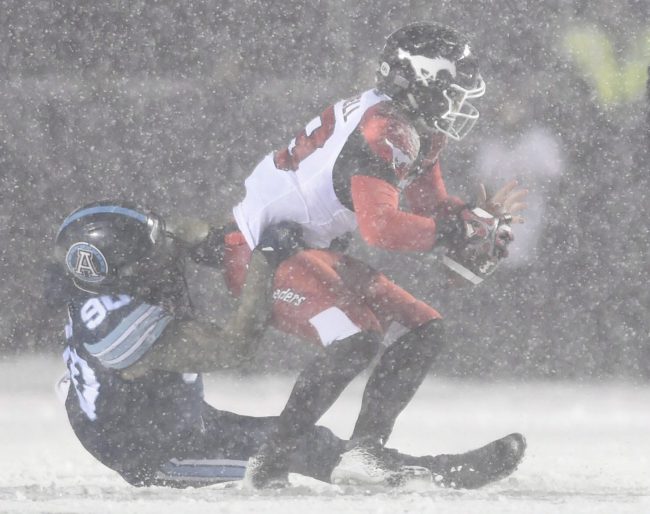 Toronto Argonauts defensive lineman Cleyon Laing (90) sacks Calgary Stampeders quarterback Bo Levi Mitchell during first half CFL football action in the Grey Cup on Nov. 26, 2017 in Ottawa.