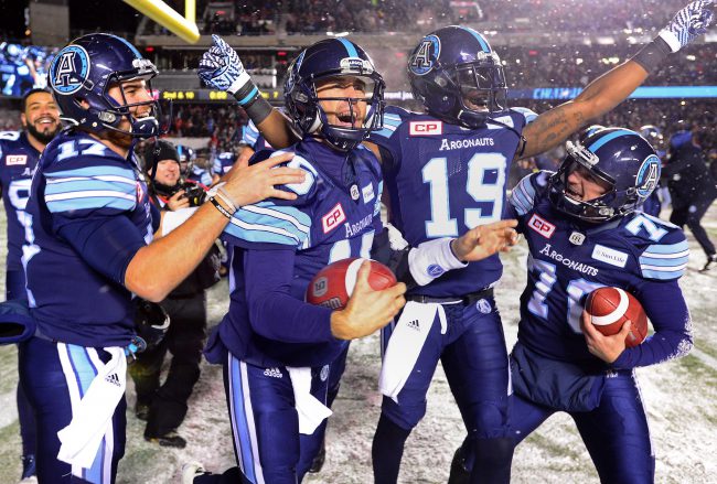 Toronto Argonauts quarterback Ricky Ray, second from left, celebrates with teammates after defeating the Calgary Stampeders in CFL football action in the 105th Grey Cup on Sunday, November 26, 2017 in Ottawa. 