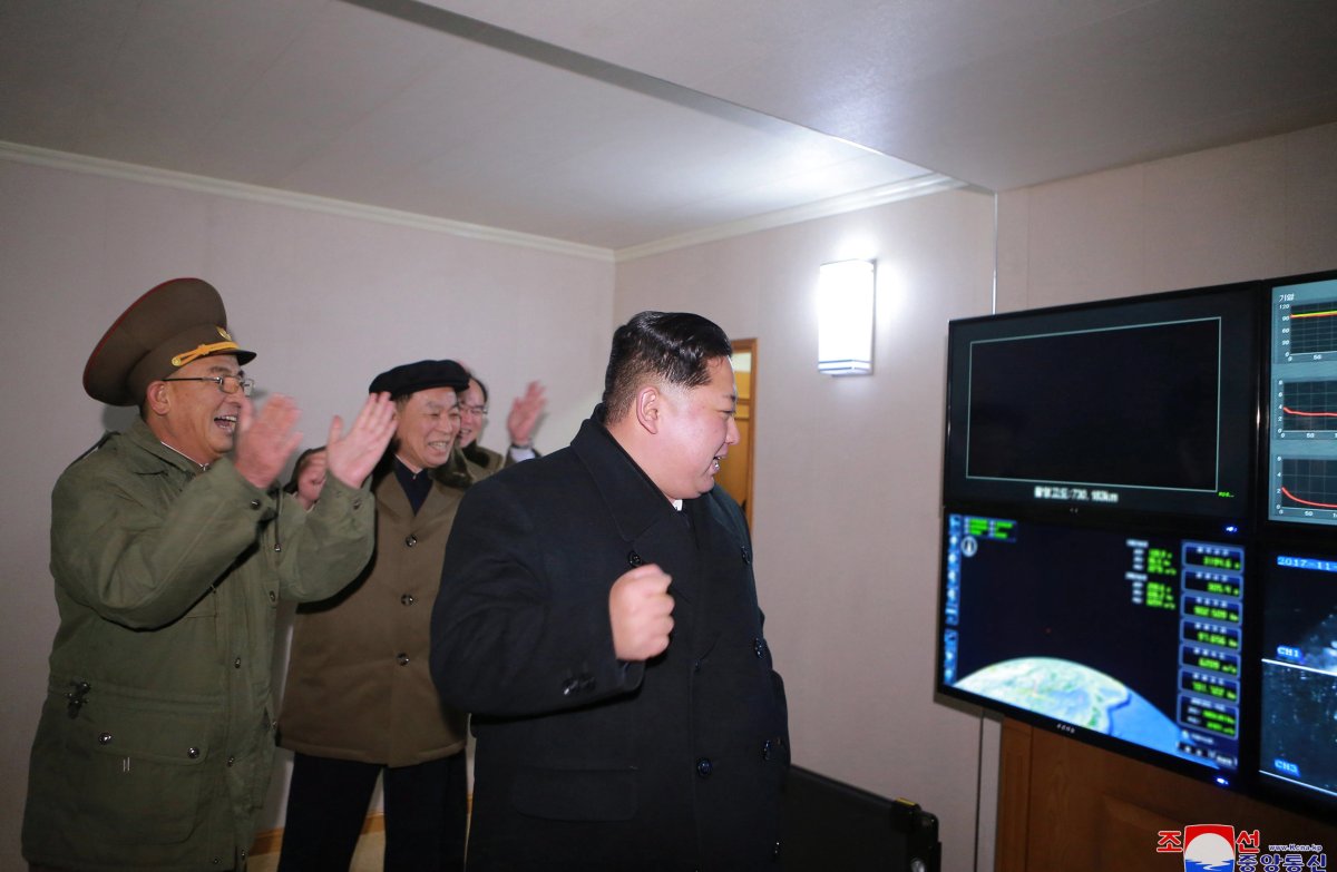 North Korean leader Kim Jong-un (R) looking at the launch of the newly developed inter-continental ballistic missile Hwasong-15 from an undisclosed location in North Korea.