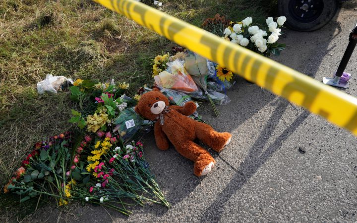 A Teddy bear lies under police tape at a makeshift memorial for those killed in the shooting at the First Baptist Church of Sutherland, Texas, U.S., Nov. 6, 2017.  