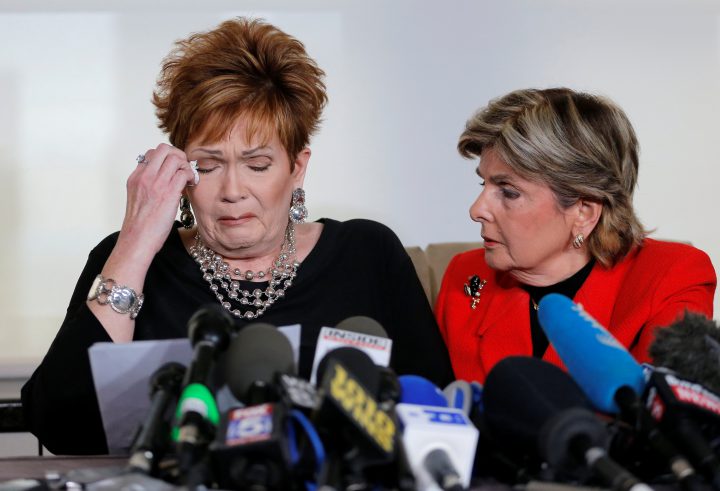 Beverly Nelson reacts as she reads a statement to reporters with attorney Gloria Allred during a news conference announcing new allegations of sexual misconduct against Alabama Republican candidate Roy Moore, in New York, Nov. 13, 2017.