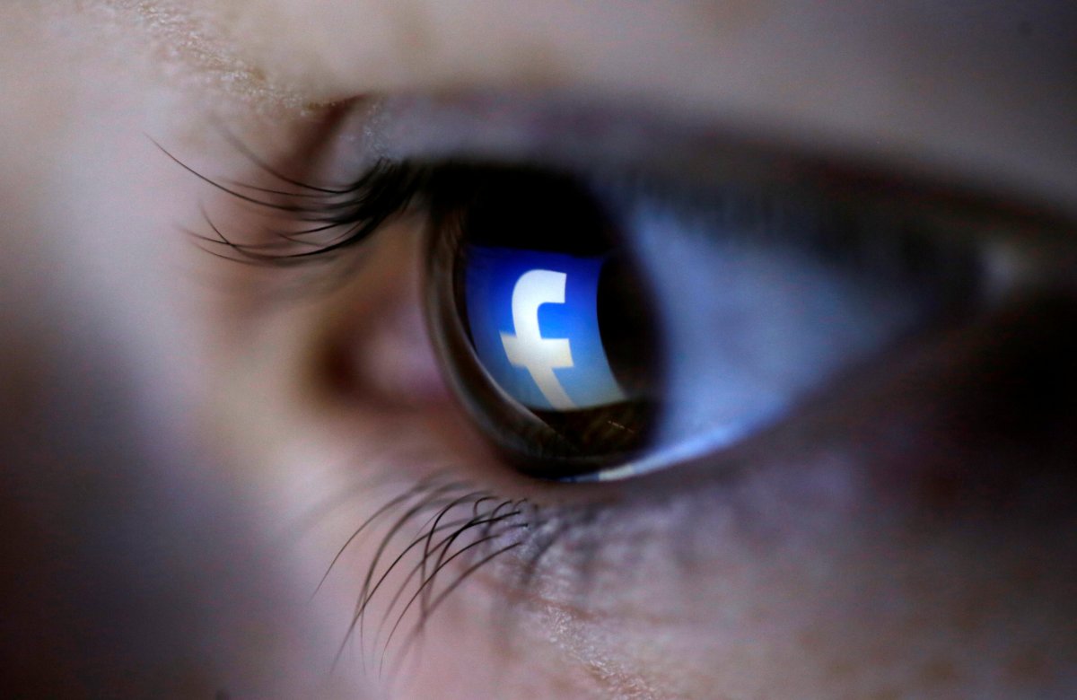 A picture illustration shows a Facebook logo reflected in a person's eye, in Zenica, March 13, 2015.
