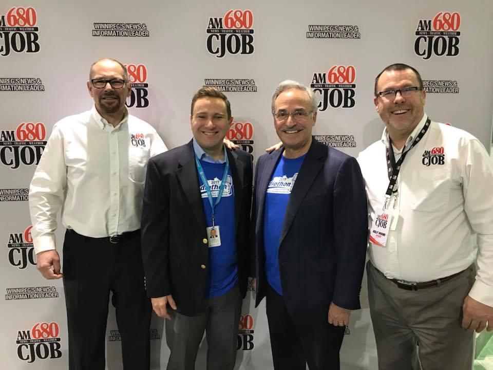 680 CJOB's Geoff Currier and Kelly Moore flank St. Boniface Hospital Foundation CEO and President Vince Barletta along with the Radiothon of Hope and Healing Presenting Sponsor Larry Vickar of the Vickar Automotive Group.