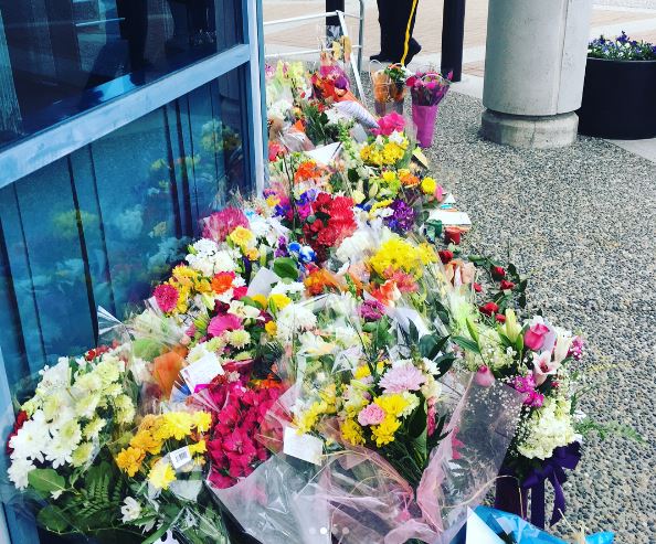 Flowers laid for Const. John Davidson and the Abbotsford Police Department outside the detachment.