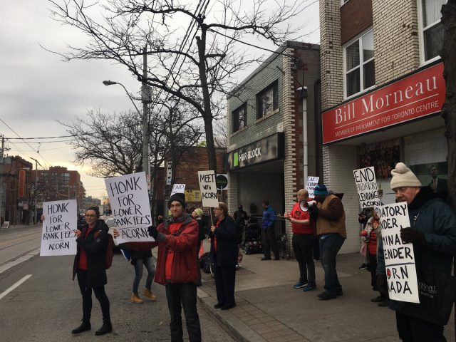 Demonstrators gathered in Hamilton, and outside the Toronto offices of federal finance minister Bill Morneau, to demand "fair banking.".