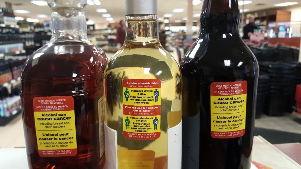 These labels have been affixed to liquor bottles at the Whitehorse liquor store to warn drinkers of the potential harm. 