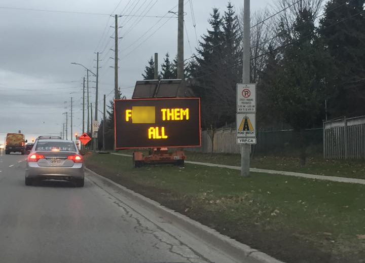 Officials say an electronic road sign in Aurora, Ont., was "hacked" to display obscene language.