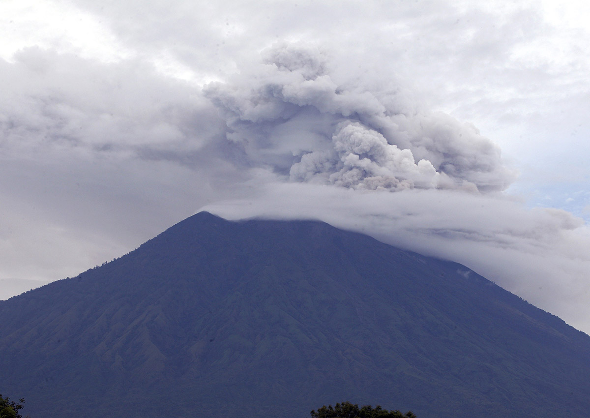 Mount Agung volcano spews smoke and ashes in Karangasem, Bali, Indonesia, Wednesday, Nov. 29, 2017.
