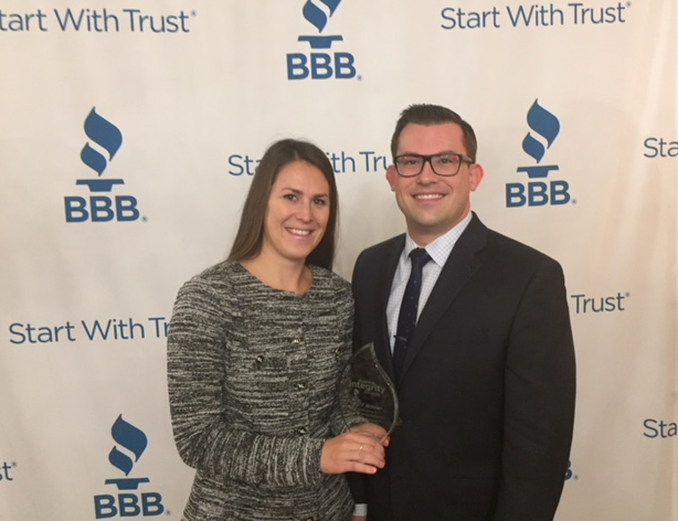 Vice-presidents of BlueStone Properties Inc. Jaclyn Pisarczyk and Colin Bierbaum accept an award at the 20th annual BBB Business Integrity Awards in London on Thursday.