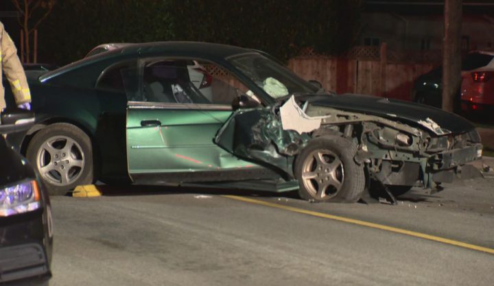 A vehicle crashed into a parked van on Rumble Street and Macpherson Avenue around 2 a.m. Credit: Global News