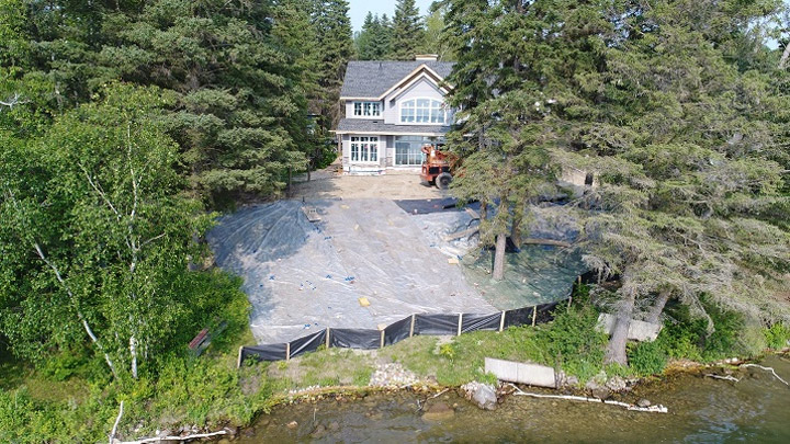 An American doctor and his Manitoba contractor have been fined for altering the shoreline of Madge Lake in Saskatchewan during construction of a cabin.