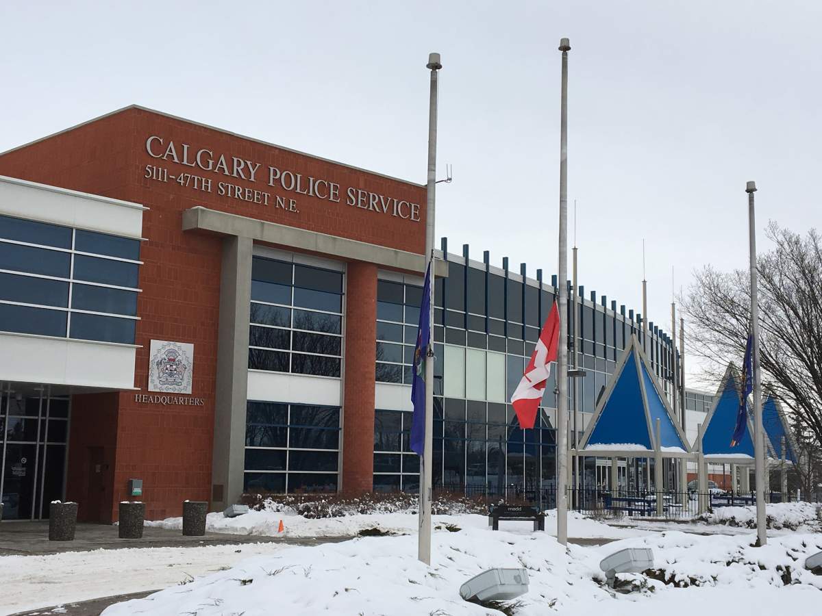 Flags half-staff outside the Calgary Police Station Tuesday.